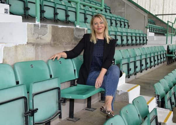 Julie Roberts in her dad's seat at Easter Road. Picture: Julie Bull