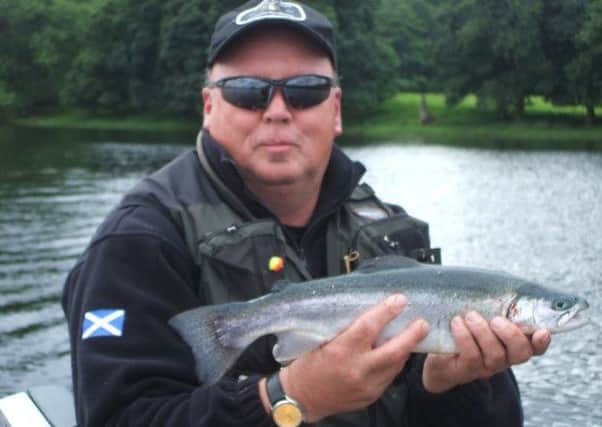 Gus Armour from Coupar with 3lb blue taken on a booby at Lake of Menteith