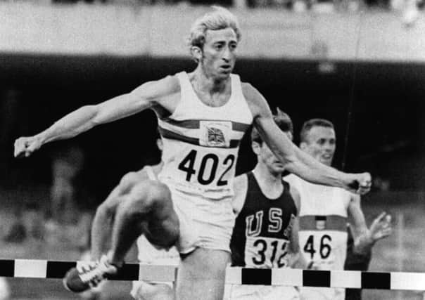 David Hemery (GBR) leaps the final hurdle before taking the gold in the 400m hurdles at the ''68 Olympics in Mexico City.