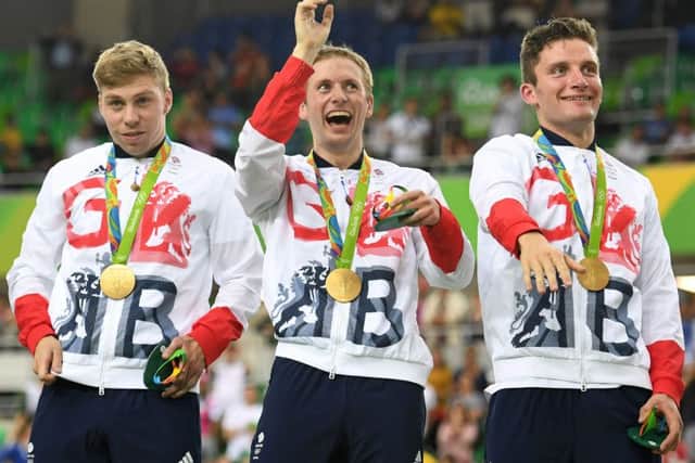 From left, Britain's Philip Hindes, Jason Kenny and Callum Skinner pose on the podium with their medals. Picture: Getty
