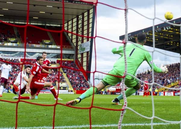 Tony Watt is slightly off balance as he blazes over the bar from eight yards out with three minutes left at Pittodrie