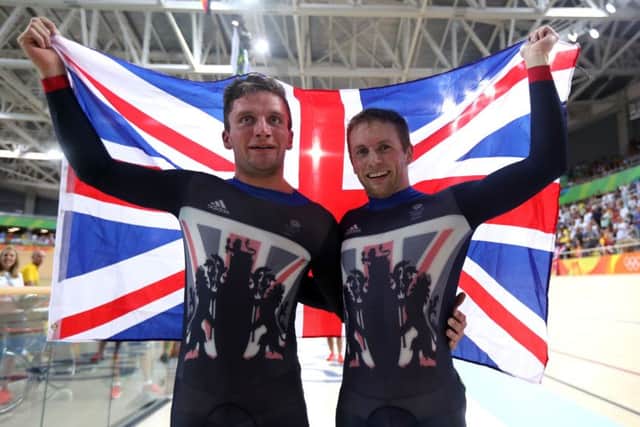 Great Britain's Jason Kenny has won the gold medal in the men's sprint with team-mate Callum Skinner (left). Picture: PA
