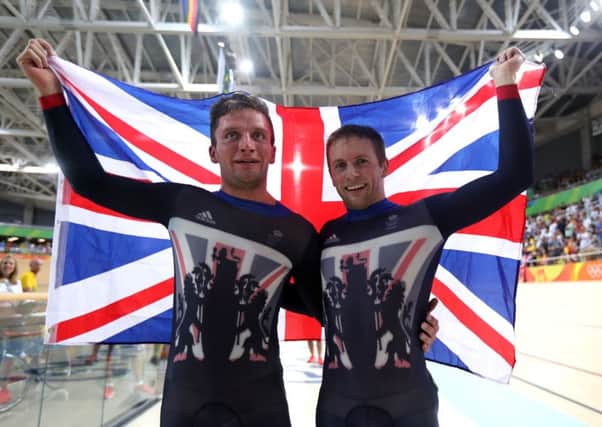 Great Britain's Jason Kenny has won the gold medal in the men's sprint with team-mate Callum Skinner (left). Picture: PA