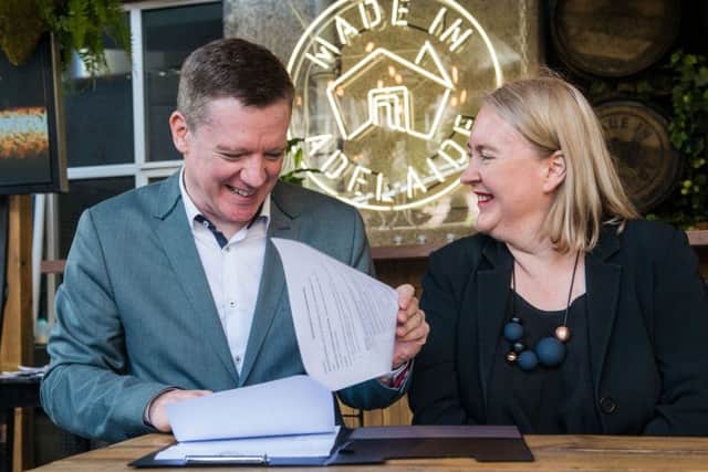 EIF director Fergus Linnehan and Rachel Healy, co-artistic director of the Adelaide Festival, agree the deal. Picture: Ian Georgeson
