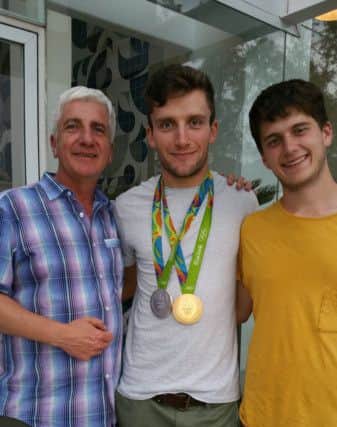 Gold - and silver - medal winning cyclist Callum Skinner with his father Scott Reid-Skinner and brother, Roy In Rio.