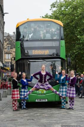 Edinburgh Bus Tours Launch with Tattoo Pipers and Highland Dancers in the Grassmarket and three of the new buses. Picture, Steven Scott Taylor