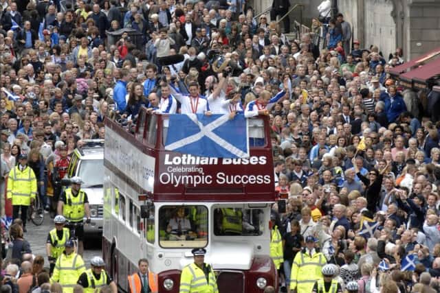 Triple Gold medallist Chris Hoy, along with other Scottish medal winners from the Beijing Olympics had a reception held in their honour at Edinburgh Castle followed by a bus-top parade down the Royal Mile. 27th August 2008. Picture by JANE BARLOW