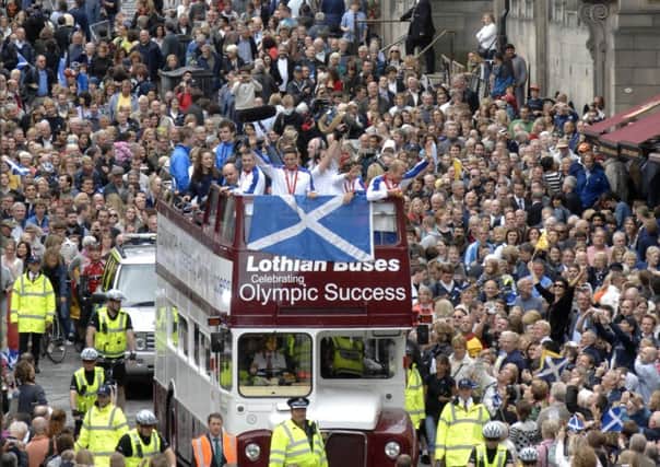 Triple Gold medallist Chris Hoy, along with other Scottish medal winners from the Beijing Olympics had a reception held in their honour at Edinburgh Castle followed by a bus-top parade down the Royal Mile. 27th August 2008. Picture by JANE BARLOW