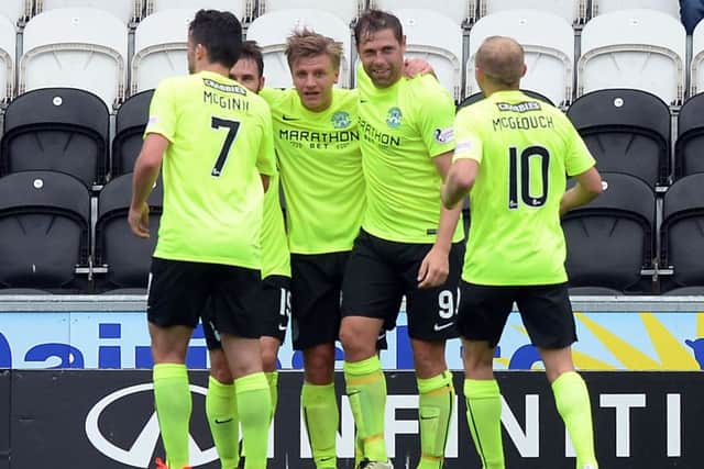 Hibs celebrate yet another Jason Cummings goal. Pic: SNS