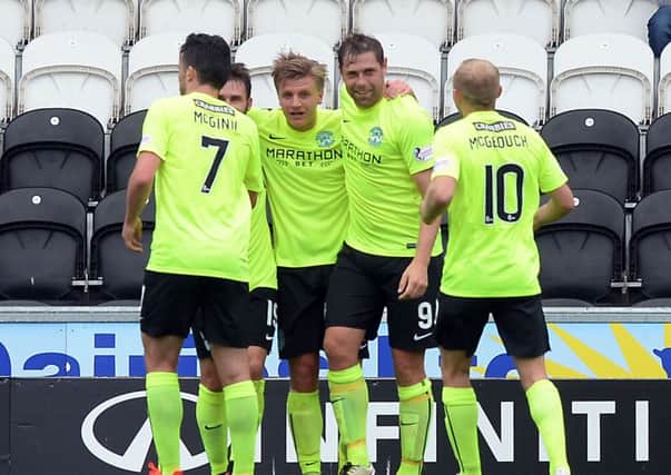 Hibs celebrate yet another Jason Cummings goal. Pic: SNS