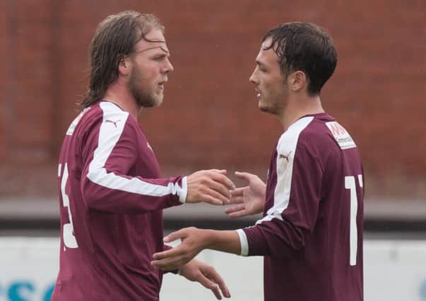 Substitute Graham Weir, left, celebrates after scoring Linlithgow's third. Picture: Toby Williams