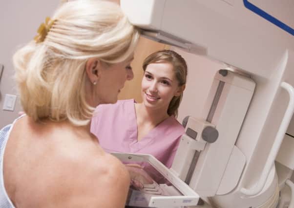 A woman taking part in breast cancer screening. Picture: PA