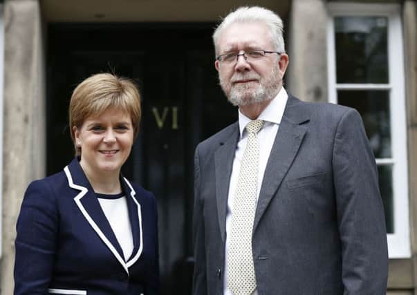 Nicola Stugeon with SNP veteran Michael Russell, outside Bute House Picture; PA