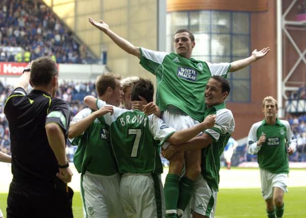 Ivan Sproule is hoisted by his team-mates after his second goal  there was more to come