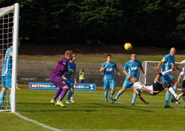 Osman See scores his spectacular bicycle kick to put City ahead after 65 minutes. Picture: Scott Louden
