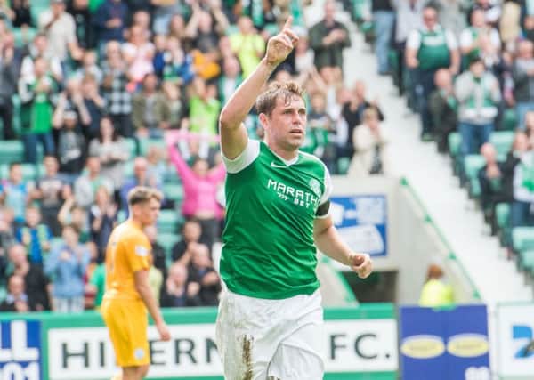 Grant Holt celebrates his first goal for Hibs in the 4-0 win over Morton. The striker feels the team are reaping the rewards of being more direct with their attacking play. Pic: Ian Georgeson