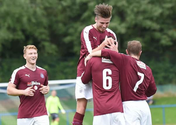 No. 6 Jack Beaumont is congratulated after scoring Linlithgows second