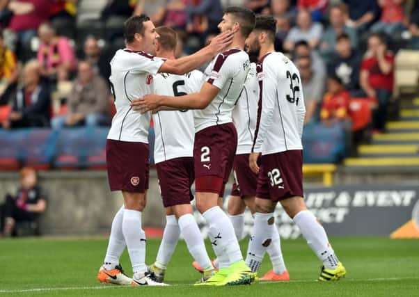 Hearts players celebrate Callum Paterson's goal at Partick - but will the Jambos hold on to their in-demand right-back ahead of Wednesday's transfer deadline? Pic: SNS
