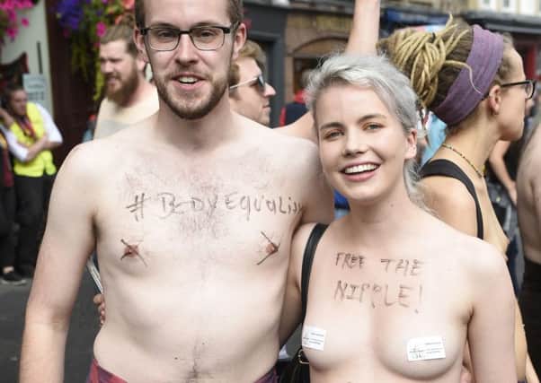 Free the nipple campaigners on the Royal Mile who are against censorship. Picture: Greg Macvean