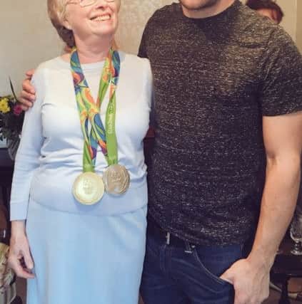 Callum's granny tries on his medals for size. Picture: contributed