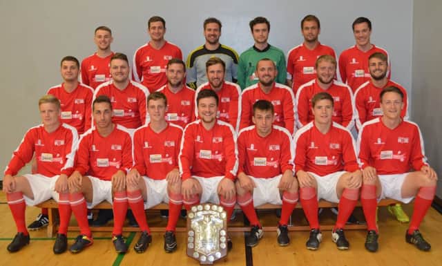 Edinburgh Rose show off their new kit, donated by the Postcode Community Trust, and their amateur Premier Division trophy