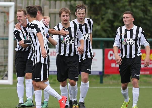 Leith Athletic players celebrate one of their goals against St Cuthbert Wanderers, a game they won 3-0 in Kirkcudbright