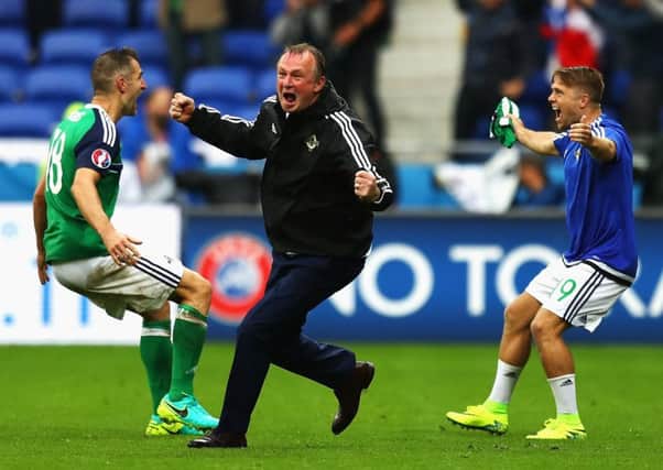 Manager Michael O'Neill celebrates Northern Ireland's second goal in their Euro 2016 victory over Ukraine in June. Picture: Getty