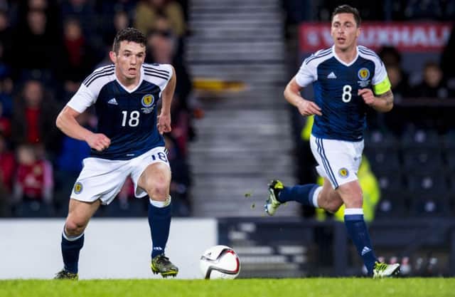 Scott Brown, right, aided John McGinn, left, during his debut. Pic: SNS
