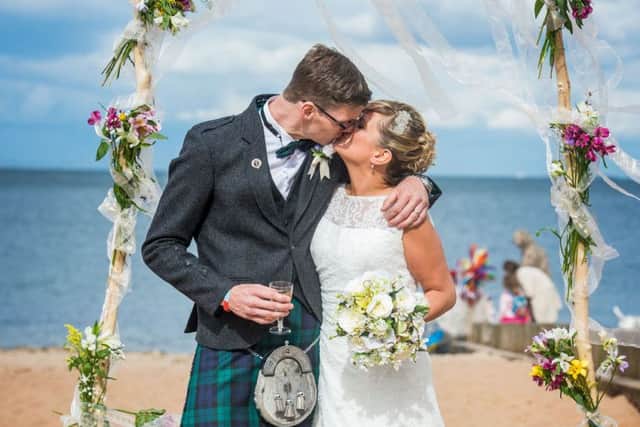 Alan Beattie and Sarah Harrison who got married on Portobello Beach.  Picture: Ian Georgeson