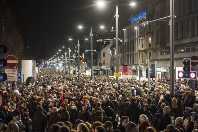 Revellers pack into Princes Street to welcome in 2016. Picture: TSPL