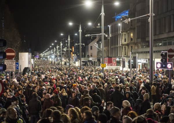 Revellers pack into Princes Street to welcome in 2016. Picture: TSPL
