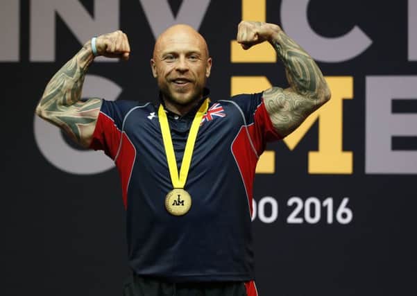 Lightweight weightlifter Michael Yule celebrates after he became the United Kingdom's first gold medal winner at the Invictus Games 2016. Picture; Peter Byrne