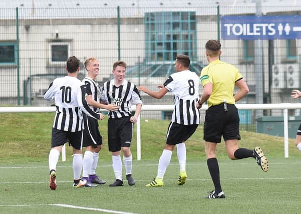 James Hainey, second from left, celebrates with his Leith team-mates after opening the scoring. Pic: David Lamb