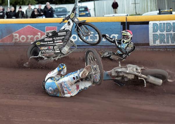 Losing control: Mark Riss, red cap, looks on after colliding with the stricken Max Clegg. Picture: Ron MacNeill