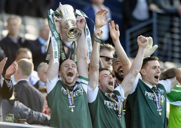 Lewis Stevenson, centre  and Paul Hanlon, right, were the first up the Hampden steps as David Gray hoisted the Scottish Cup