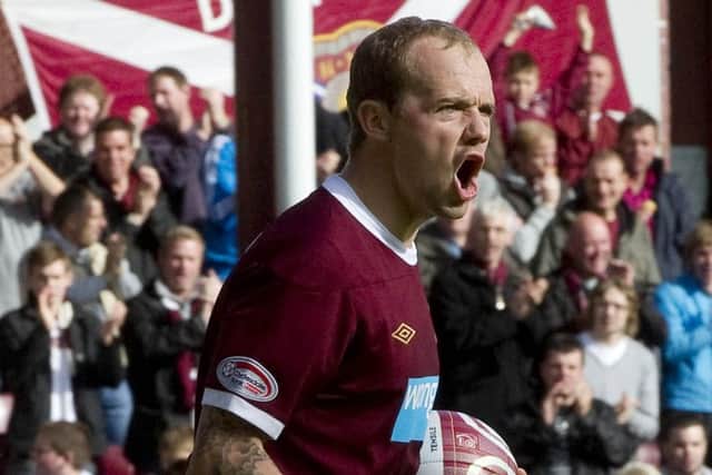 Jamie Hamill celebrates scoring from the penalty spot