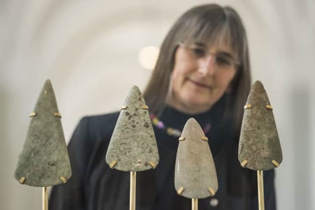 Dr Alison Sheridan with Stone Age axeheads. Pic: Phil Wilkinson.