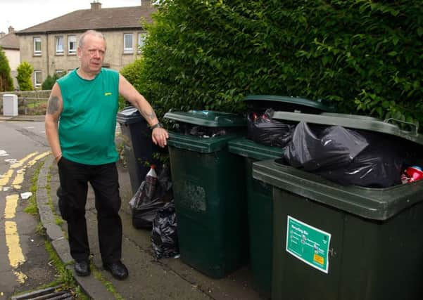 Michael Bain near his house in Restalrig Circus. The bins are overflowing and his wife cant get her wheelchair past them on the pavement.