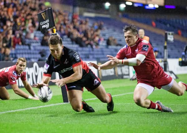 Edinburgh's Mike Allen dives on the lose ball to score the first try of the match. Picture: Graham Stuart SNS