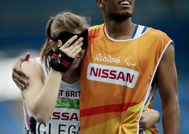 Libby Clegg and Chris Clarke had to wait nervously for the final timings