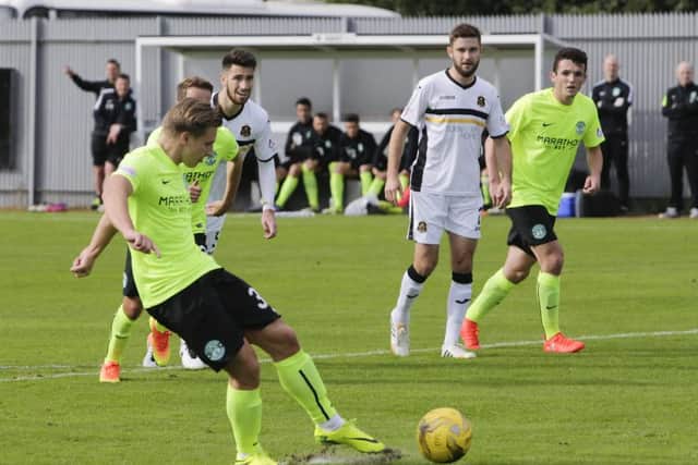 Jason Cummings converts from the penalty spot. Pic: SNS