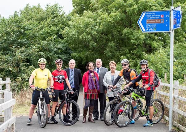 Pictured with cyclists on the Gilmerton to Roslin cyclepath are Edinburgh Councillor Lesley Hinds, Daisy Narayanan, acting director, Sustrans Scotland, David Kenny, senior consultant engineer, Midllothian Council, and Neil Dougall, road services manager, Midlothian Council. Photo: Wullie Marr/DEADLINE NEWS