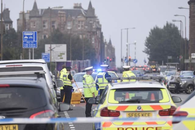 Police attend an incident on Portobello Road which saw the road closed to traffic. Picture: Greg Macvean