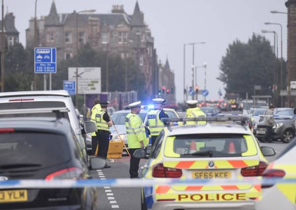 Police attend an incident on Portobello Road which saw the road closed to traffic. Picture: Greg Macvean