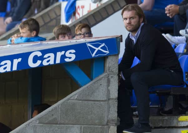 Hearts head coach Robbie Neilson watches from the stand at McDiarmid Park