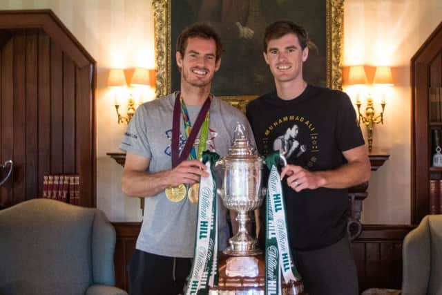 Andy and Jamie Murray with the trophy at Cromlix House in Dunblane. Picture: Hibernian Media