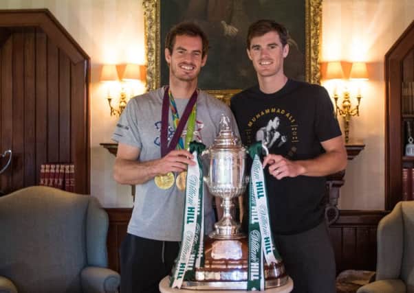 Andy and Jamie Murray with the trophy at Cromlix House in Dunblane. Picture: Hibernian Media