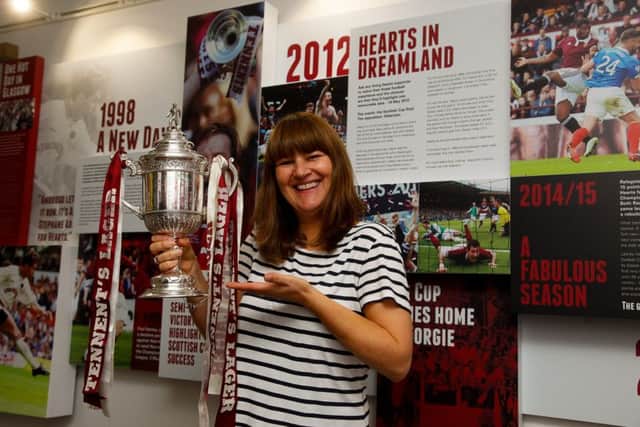 Curator Caroline Mathers with a selection of the items in the new museum. Picture: Scott Louden