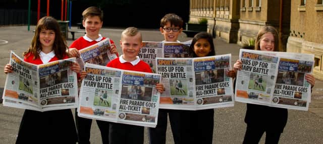 Pupils of The Royal High Primary help promote the Evening News reading project .