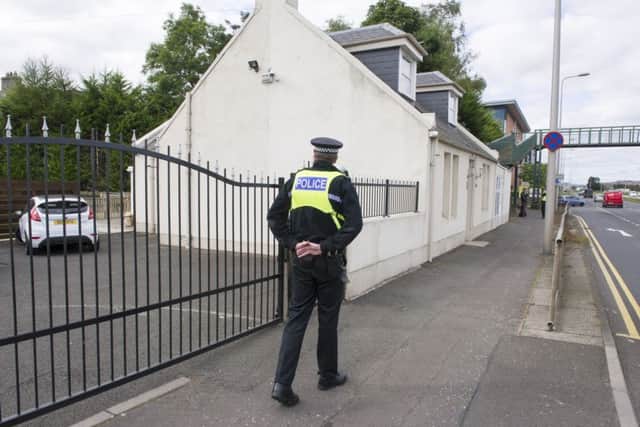 A police officer patrols outside the crime scene at Ratho Station after a shooting incident.  Picture Ian Rutherford